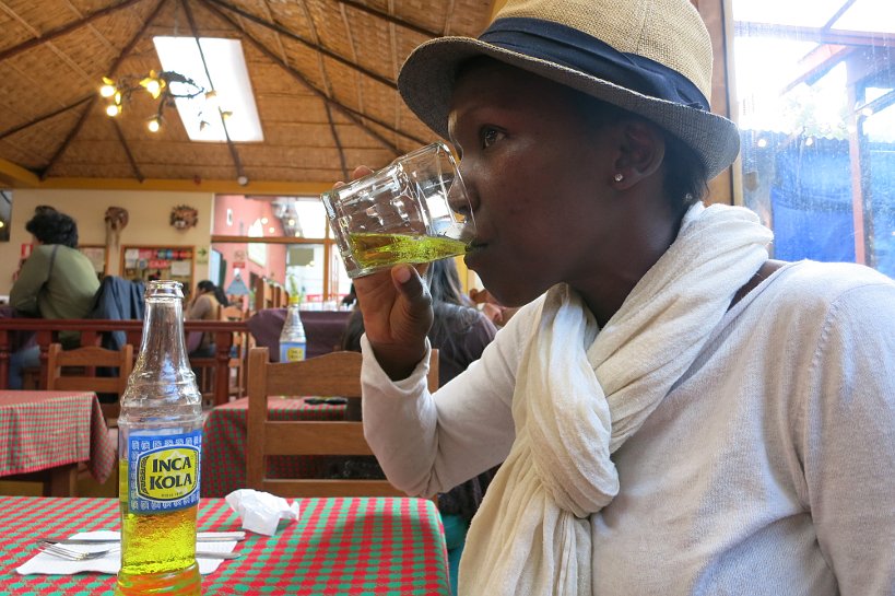 Rosemary drinking Inca Kola by Authentic Food Quest