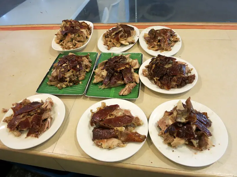 Plates of Rico's spicy lechon cebu lechon authentic food quest