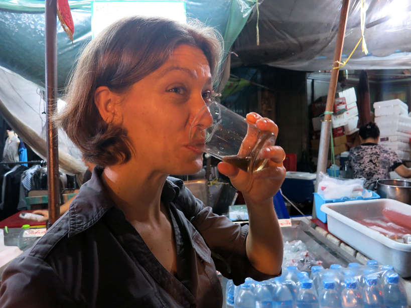 Bitter tasting chinese herb drink at bangkok at night tour with Expique