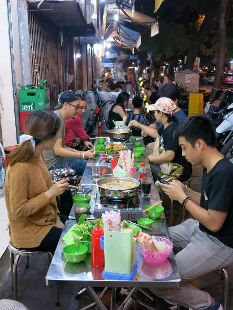 People Eating Lau a winter food in hanoi by Authentic Food Quest