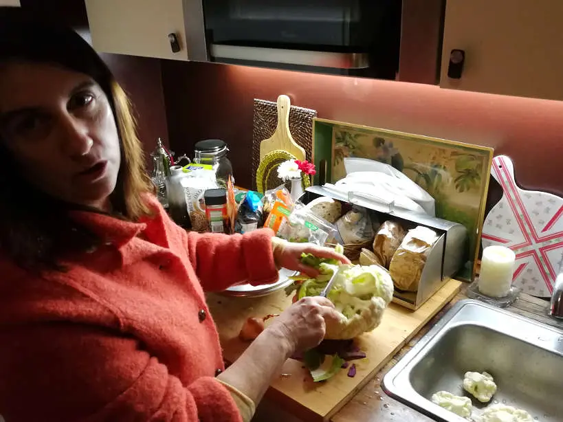Cristina preparing Cauliflower Soup for Portuguese food for Portuguese Dinner for Eating with Portuguese family by Authentic Food Quest in a cooking class in Lisbon at Cristina's home
