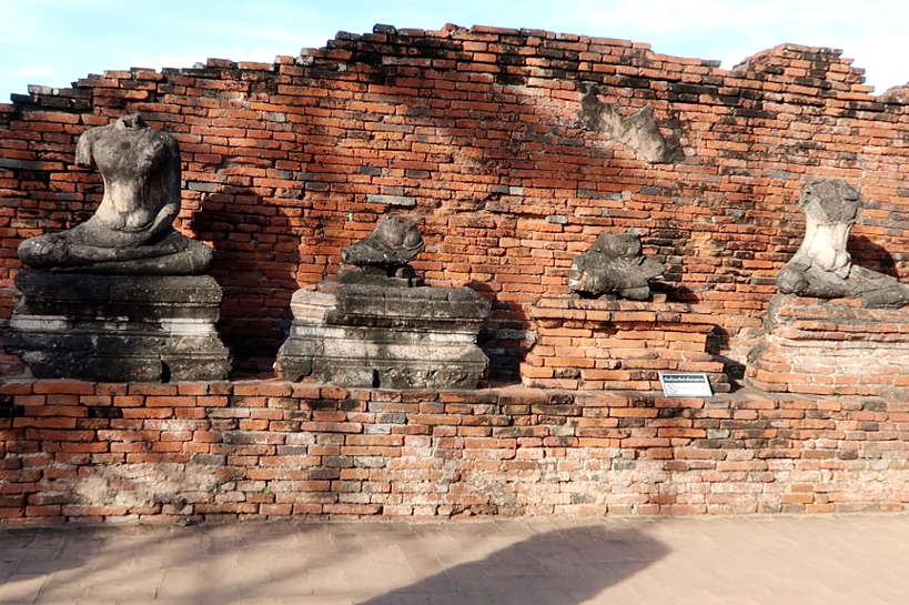 Wat Chaiwatthanaram Headless Buddha images seen on Ayutthaya Day Tour by Authentic Food Quest. Visiting Ayutthaya temples is one of the many things to do on you day trip to Ayutthaya