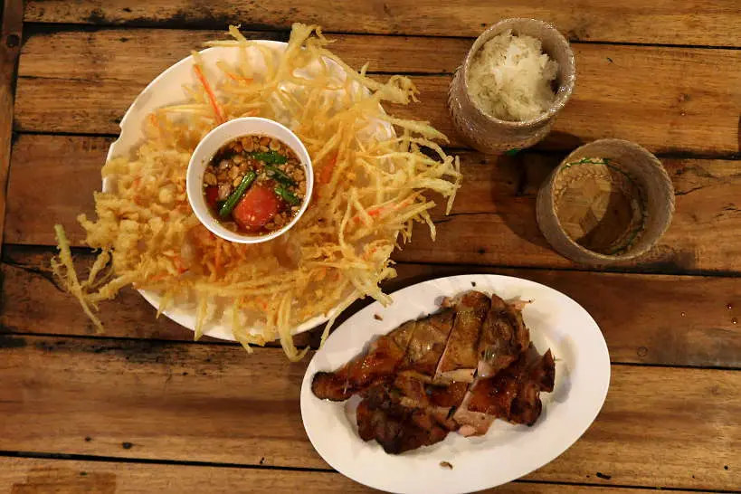 Fried Papaya Salad and Grilled Chicken at Cherng Doi one of the Best restaurants in Chiang Mai by Authentic Food Quest