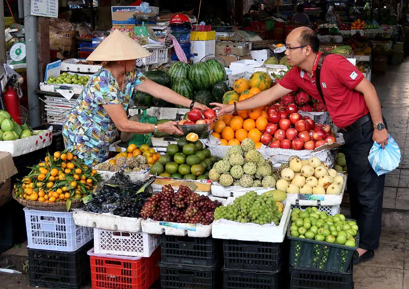 Fruit Vendor Outside Cho Con Market Danang by Authentic Food Quest