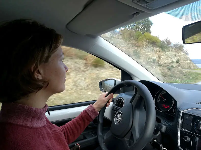 Claire driving car rental in Portugal for Allianz Travel Insurance