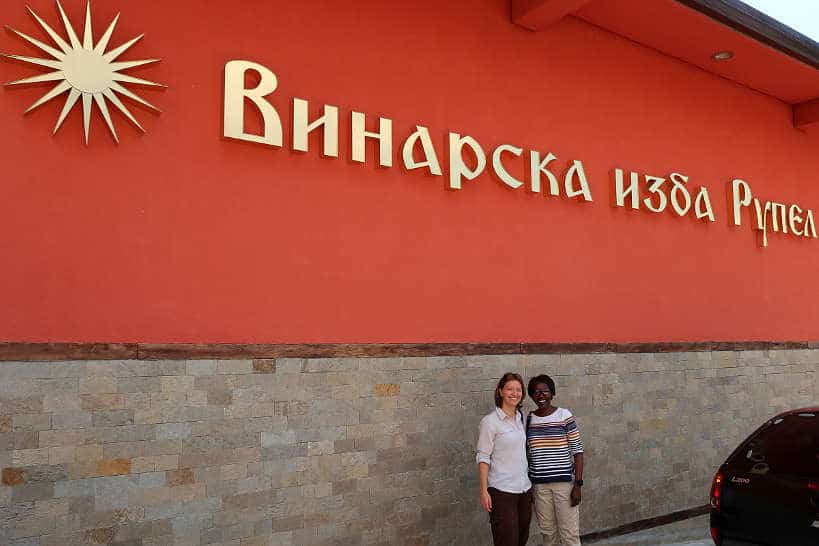 Claire and Rosemary at Rupel Winery Sign Melnik Bulgaria by Authentic Food Quest