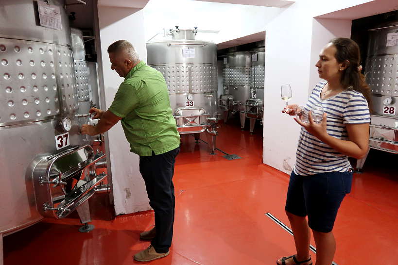 Pavel Serving Tamianka Wine in Melnik Bulgaria by Authentic Food Quest