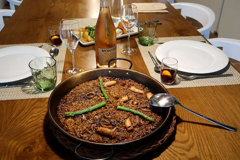 Eating a delicious Paella after Taking a Cooking Class in Spain by AuthenticFoodQuest