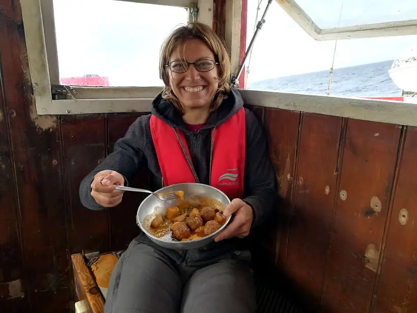 Claire eating Lunch on a Palamos Boat by AuthenticFoodQuest