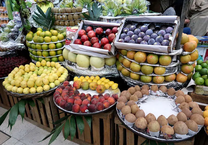 Fruit Stand inside Mercado de Medellin Mexico City food markets 
 by Authentic Food Quest