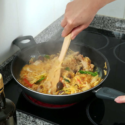 Stirring Bacalhau a Bras by Authentic Food Quest
