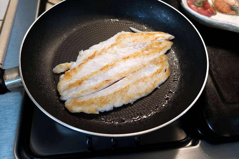 Pan seared sea bass after cooking by Authentic Food Quest