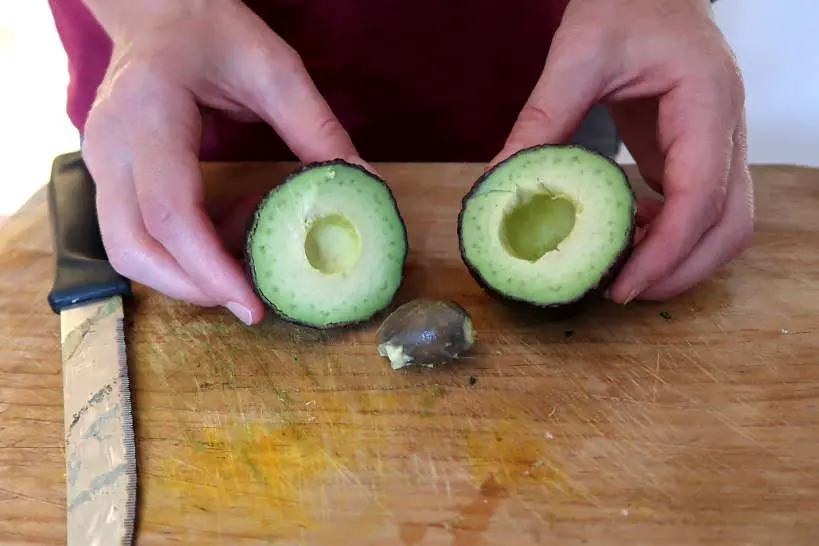 Avocado cut in half by Authentic Food Quest for Mexican gaucamole recipe