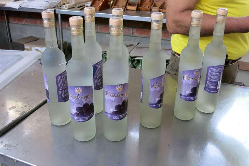 Bottles of Pisco Uvina at Rivadeneyra a Pisco Winery in Lunahuana Peru by AuthenticFoodQuest