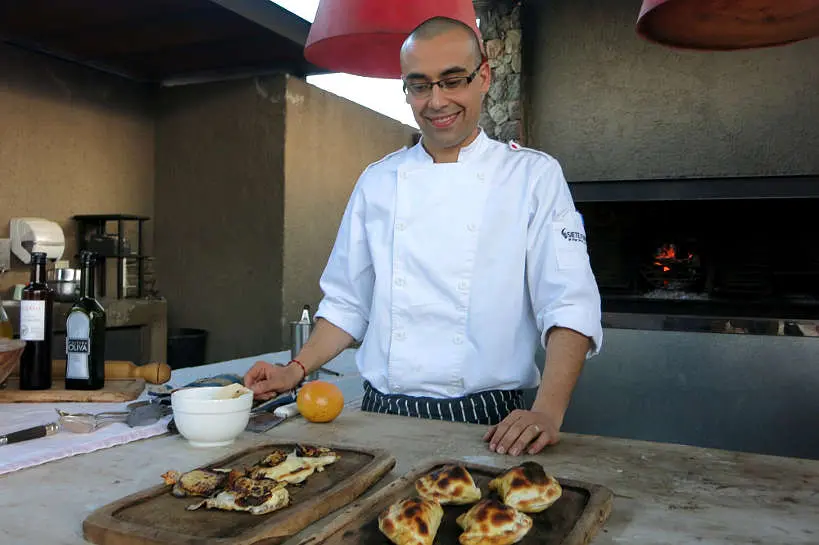 Chef Matias preparing Empanadas at Siete Fuegos Francis Mallmann Restaurant by AuthenticFoodQUest