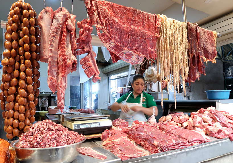Shopping at the butcher at Mercado de Abastos for cooking class in Oaxaca by Authentic Food Quest