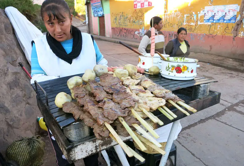 Anticuchos vendor in the street of Cusco by authentic Food Quest