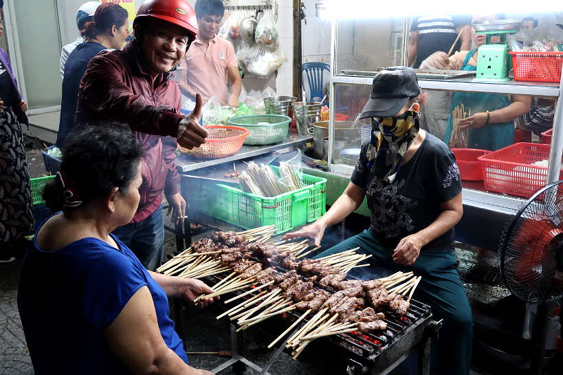Nem Lui Cooking in the street Where to Eat in Danang by AuthenticFoodQuest