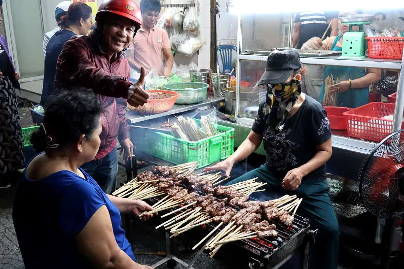 Nem Lui Cooking in the street Where to Eat in Danang by AuthenticFoodQuest