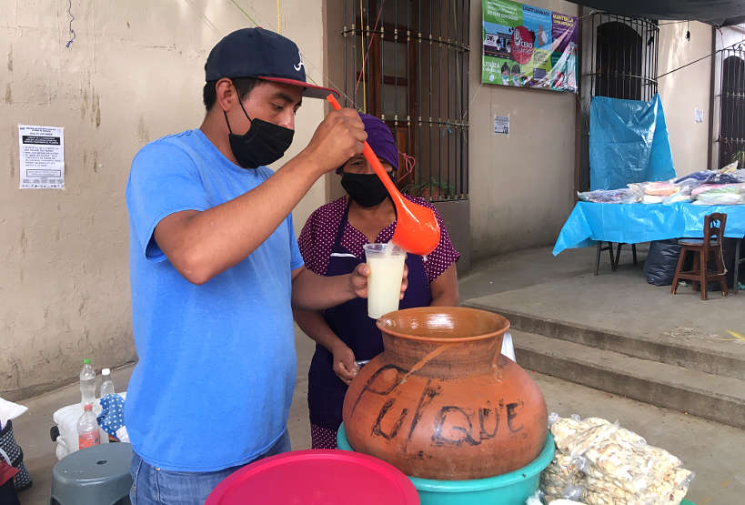 Pulque vendor at La Merced Oaxaca market by Authentic Food Quest