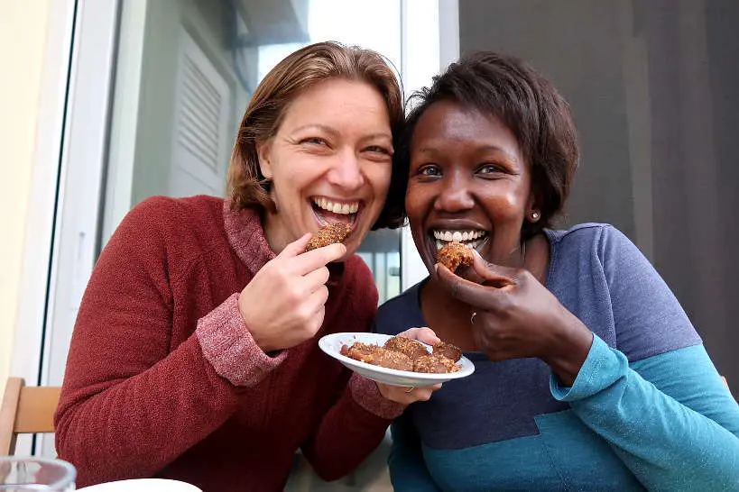 Claire and Rosemary eating Melomakarona by Authentic Food Quest