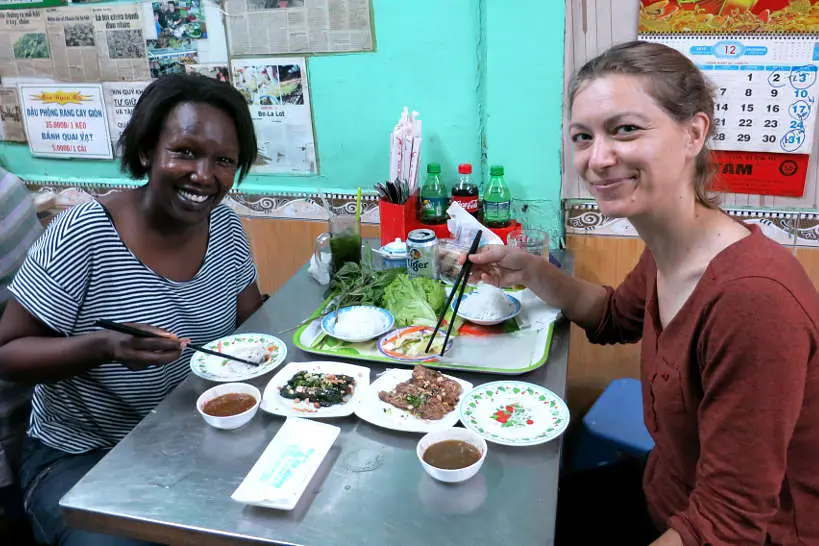 Rosemary and Claire eating bo la lot for food in Saigon by Authentic Food Quest