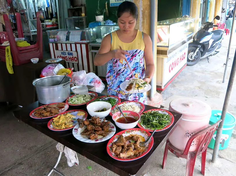 Broken rice com tam street food stand in Vietnam by Authentic Food Quest