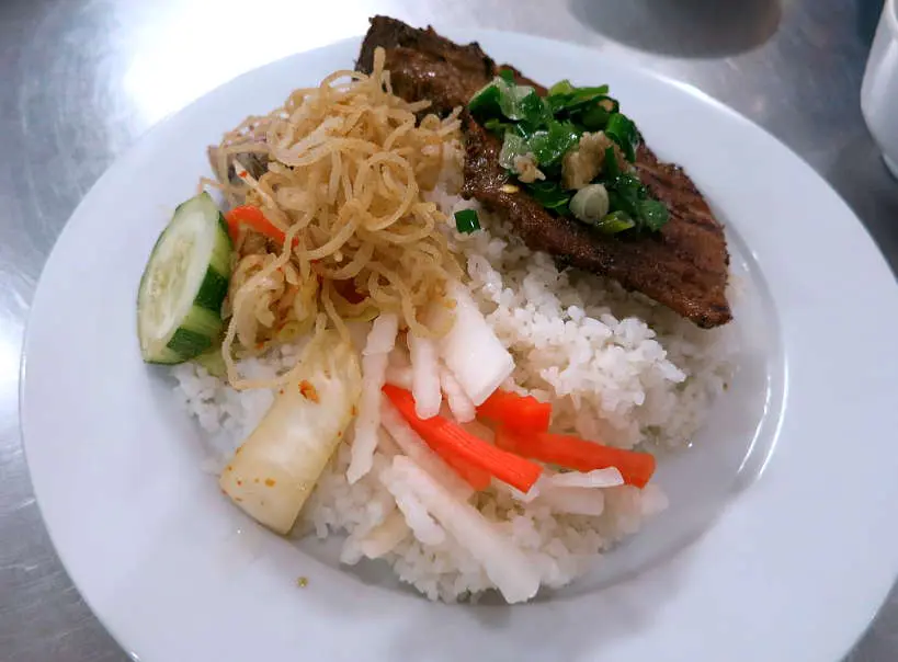 Broken rice pork chop Com tam suon nuong by Authentic food Quest