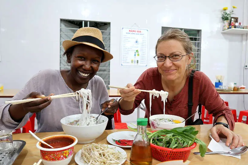 Rosemary and Claire eating pho Vietnam soups in Danang by authentic food quest
