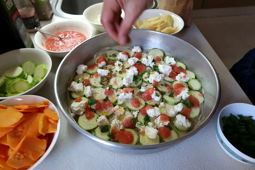 Preparing the layers of vegetables for boureki recipe by Authentic Food Quest