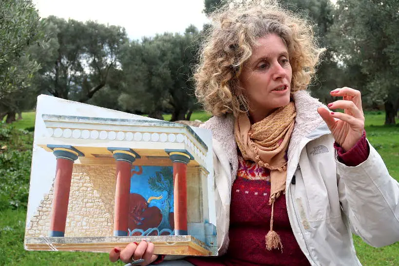 Aspassia showing us knossos imagery for olive oil tasting crete by Authentic Food Quest