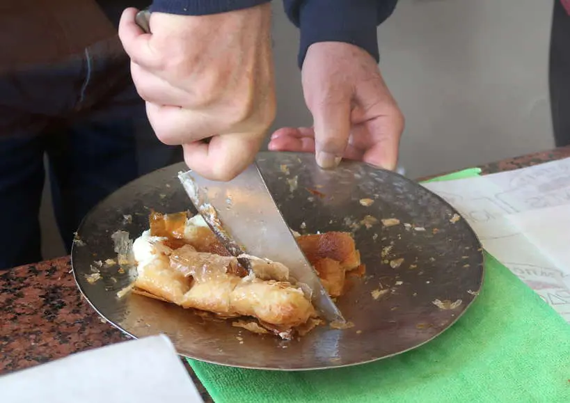 Serving bougatsa Chania Crete by Authentic Food Quest