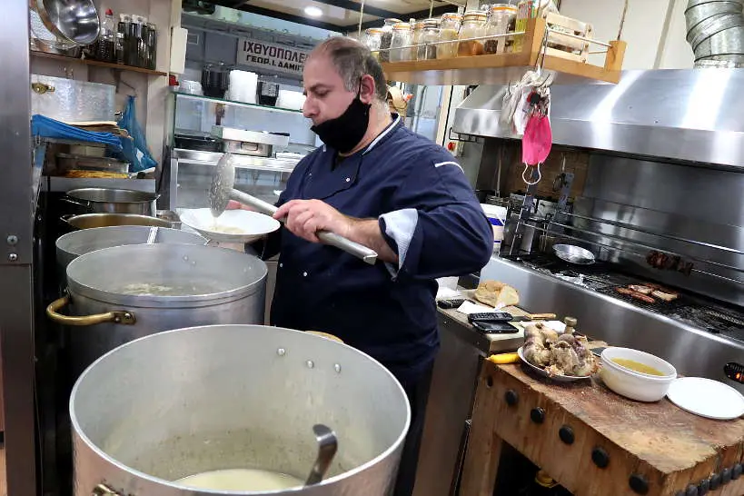 Stamatis Serving Soup at Patsas Agnos Marmaritzakis restaurant in chania crete by AuthenticFoodQuest