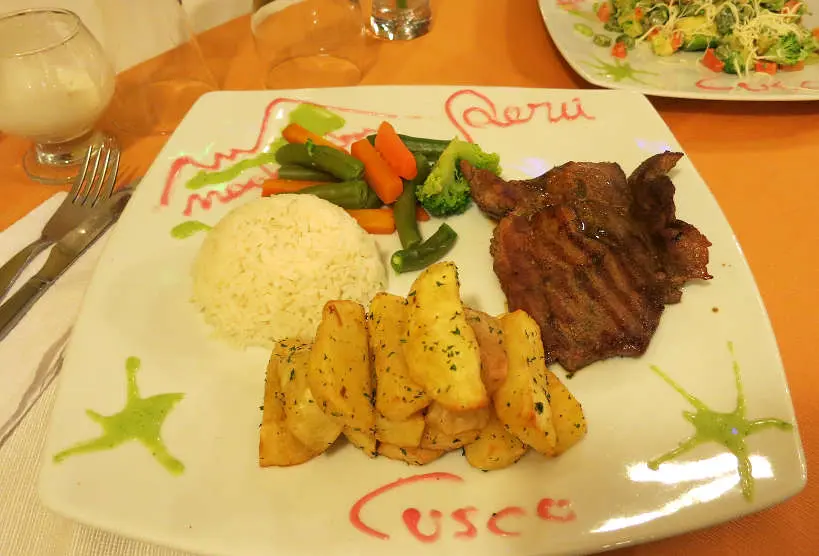 Alpaca steak in Peru Cusco food by Authentic Food Quest