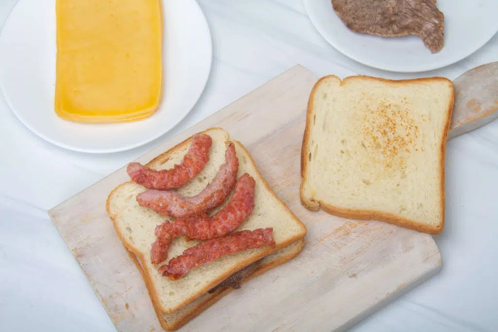 Assembling Francesinha with Sausages by Authentic Food Quest