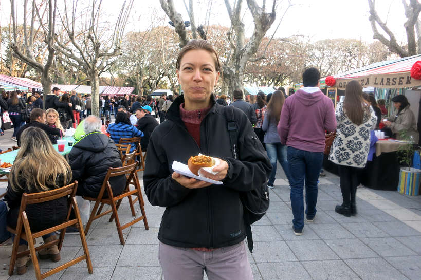 Claire eating Empanadas Buenos Aires Market by Authentic Food Quest
