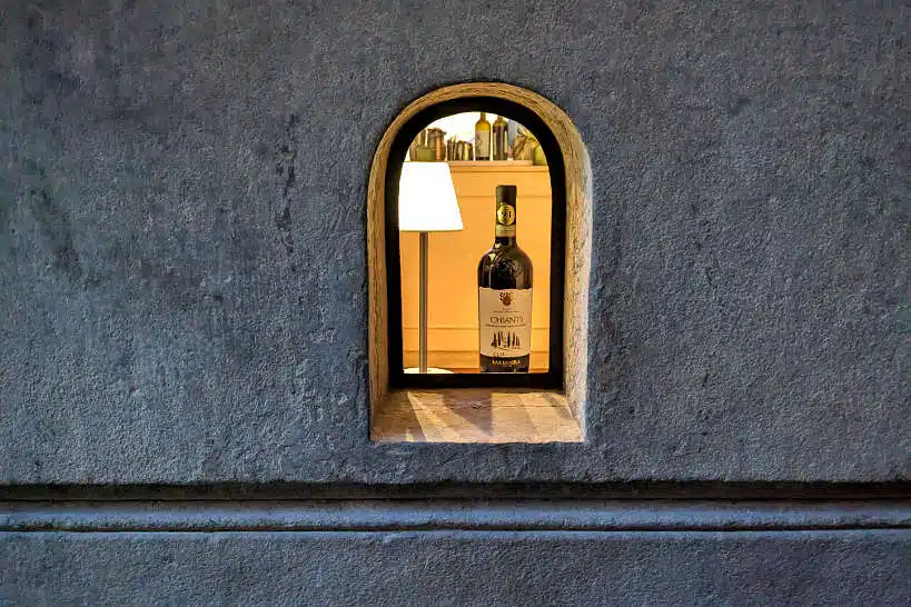 Chianti bottle at Cantina de Pucci wine window in FLorence by AuthenticFoodQues