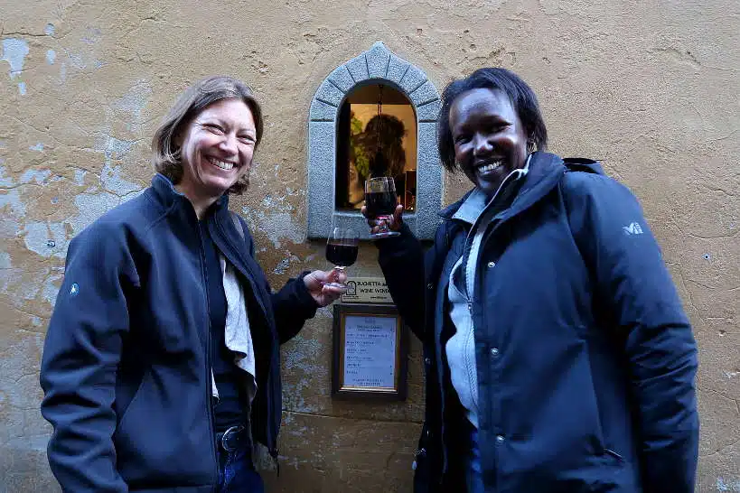 Claire and Rosemary ordering from the wine windows in Florence by AuthenticFoodQuest